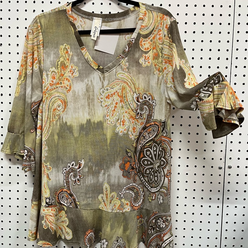 Brown w/touch yellow & org. Bias V neck, 3/4 slve end flutter Bias below waist.